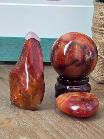 Carnelian Crystal Gift Set | Carnelian Sphere, Flame, Heart & Wooden Display Stand | 4-Piece Decorative Crystal Collection